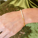 Sculptural bangle bracelet worn on wrist