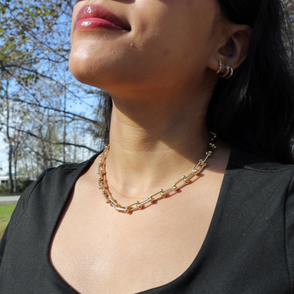 Gold link necklace clasp detail