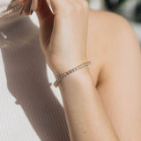 Slim tennis bracelet worn on wrist