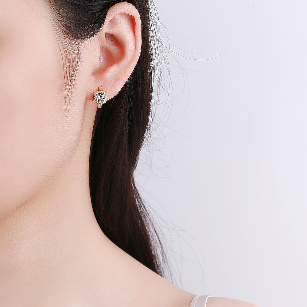 Square stud earring worn