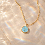 Gold Cross Medallion Necklace with Pearl Tone Center