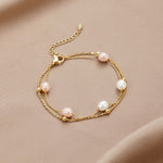 Double Strand Pearl Station Gold Bracelet
