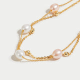 Double Strand Pearl Station Gold Bracelet